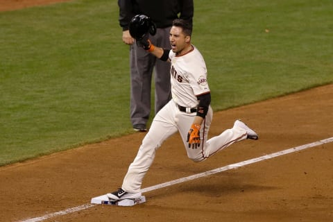 SAN FRANCISCO, CA – OCTOBER 16: Travis Ishikawa #45 of the San Francisco Giants celebrates after he hits a three-run walk-off home run to defeat the St. Louis Cardinals 6-3 during Game Five of the National League Championship Series at AT&T Park on October 16, 2014 in San Francisco, California. (Photo by Jason O. Watson/Getty Images)