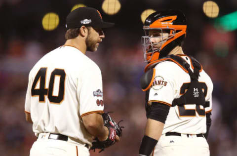 SAN FRANCISCO, CA – OCTOBER 10: Madison Bumgarner #40 of the San Francisco Giants speaks with Buster Posey #28 during Game Three of their National League Division Series against the Chicago Cubs at AT&T Park on October 10, 2016 in San Francisco, California. (Photo by Ezra Shaw/Getty Images)