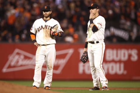 SAN FRANCISCO, CA – OCTOBER 11: Brandon Crawford #35 and Joe Panik #12 of the San Francisco Giants stand on the field during a pitching change in the ninth inning of Game Four of their National League Division Series at AT&T Park on October 11, 2016 in San Francisco, California. (Photo by Ezra Shaw/Getty Images)