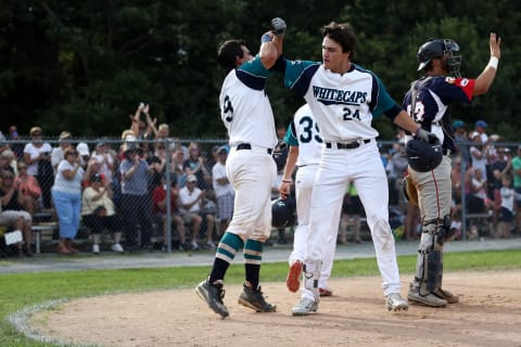 BREWSTER, MA – AUGUST 11: Hunter Bishop, right, celebrates with Michael Gasper of the Brewster Whitecaps during game one of the Cape Cod League Championship Series against the Bourne Braves at Stony Brook Field on August 11, 2017 in Brewster, Massachusetts. (Photo by Maddie Meyer/Getty Images)