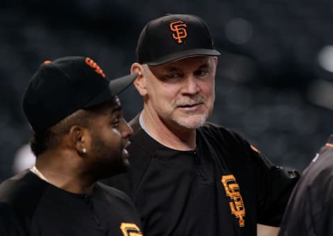 PHOENIX, AZ – SEPTEMBER 25: Manager Bruce Bochy #15 of the San Francisco Giants (R) talks with Pablo Sandoval #48 of the Giants before the start of a MLB game against the Arizona Diamondbacks at Chase Field on September 25, 2017 in Phoenix, Arizona. The Giants defeated the Diamondbacks 9-2. (Photo by Ralph Freso/Getty Images)