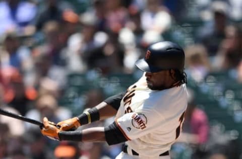 SAN FRANCISCO, CA – JUNE 20: Alen Hanson #19 of the San Francisco Giants fouls a pitch off the top of his knee against the Miami Marlins in the bottom of the first inning at AT&T Park on June 20, 2018 in San Francisco, California. (Photo by Thearon W. Henderson/Getty Images)