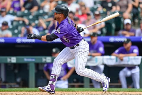 DENVER, CO – JULY 12: Gerardo Parra #8 of the Colorado Rockies hits a game tying pinch hit RBI single against the Arizona Diamondbacks in the sixth inning of a game at Coors Field on July 12, 2018 in Denver, Colorado. (Photo by Dustin Bradford/Getty Images)