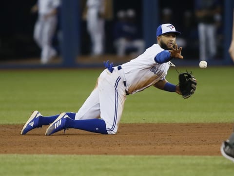 Toronto Blue Jays shortstop Richard Ureña (7) throws to second to get the force out on New York Yankees first baseman DJ LeMahieu (not pictured) during the fifth inning at Rogers Centre. (John E. Sokolowski-USA TODAY Sports)