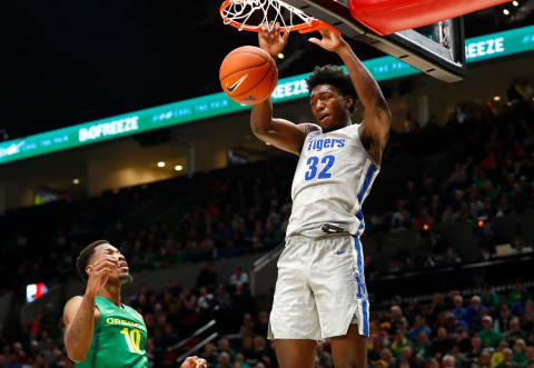 Memphis Tigers center James Wiseman dunks the ball over Oregon Ducks forward Shakur Juiston during their game at the Moda Center in Portland, Ore. on Tuesday, Nov. 12, 2019.