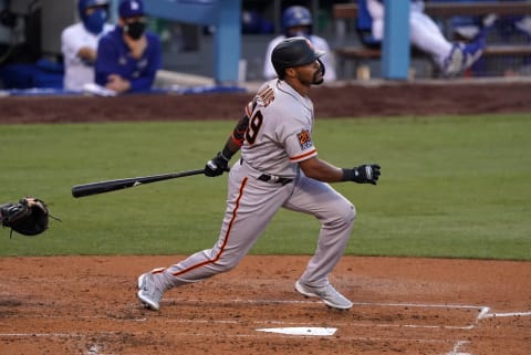 SF Giants right fielder Jaylin Davis (49) follows through on a solo home run in the third inning against the Los Angeles Dodgers at Dodger Stadium. (Kirby Lee-USA TODAY Sports)