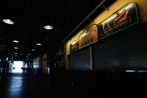 Aug 1, 2020; San Francisco, California, USA; Concession stands are closed in an empty concourse as seen before the game between the SF Giants and the Texas Rangers at Oracle Park. (Darren Yamashita-USA TODAY Sports)