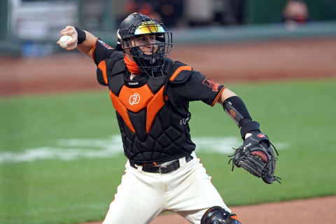 SF Giants catcher Tyler Heineman (43) throws the ball to first base to complete a strikeout during the second inning against the Texas Rangers at Oracle Park. (Darren Yamashita-USA TODAY Sports)