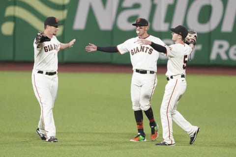 SF Giants outfielders Alex Dickerson (left), Mauricio Dubón (center), and Mike Yastrzemski (right) celebrate after the game against the Los Angeles Angels at Oracle Park. (Kyle Terada-USA TODAY Sports)