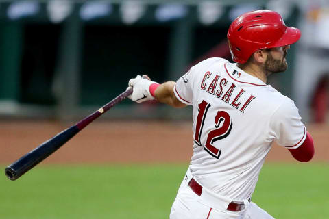 Cincinnati Reds catcher Curt Casali (12) hits a single in the third inning of a baseball game against the St. Louis Cardinals, Tuesday, Sept. 1, 2020, at Great American Ball Park. Casali signed with the SF Giants on Monday.