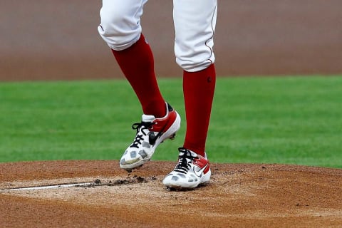 Cincinnati Reds starting pitcher Trevor Bauer (27) warms up in a custom pair of cleats featuring trash cans to poke fun at the Houston Astros cheating scandal. Ironically, the SF Giants signing Bauer would be following the same organizational model.