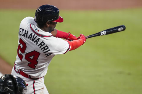 Atlanta infielder Adeiny Hechavarria (24) drives in a run with a base hit against the Miami Marlins during the first inning. (Dale Zanine-USA TODAY Sports)