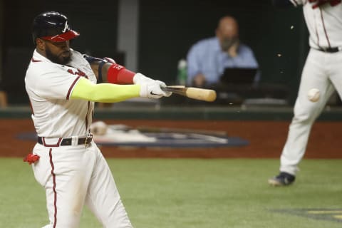 Atlanta designated hitter Marcell Ozuna (20) drives in a run with a single against the Los Angeles Dodgers during the eighth inning of game four of the 2020 NLCS at Globe Life Field. (Tim Heitman-USA TODAY Sports)