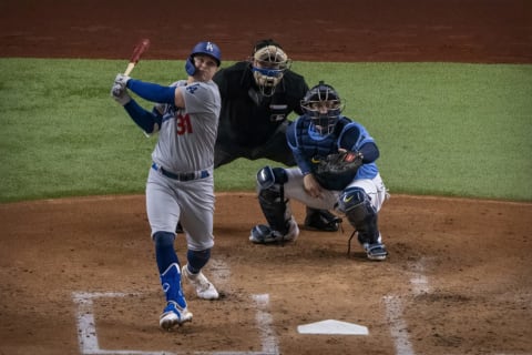 Los Angeles Dodgers left fielder Joc Pederson hits a home run against the Tampa Bay Rays during the second inning in game five of the 2020 World Series at Globe Life Field. (Jerome Miron-USA TODAY Sports)