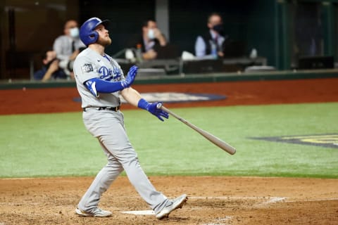 Los Angeles Dodgers first baseman Max Muncy (13) hits a home run against the Tampa Bay Rays during the fifth inning of game five of the 2020 World Series at Globe Life Field. (Kevin Jairaj-USA TODAY Sports)