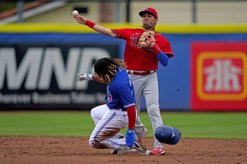 Philadelphia Phillies second baseman C.J. Chatham (30) gets the force out of Toronto Blue Jays third baseman Vladimir Guerrero Jr. (27) in the 2nd inning of the spring training game at TD Ballpark. (Jasen Vinlove-USA TODAY Sports)