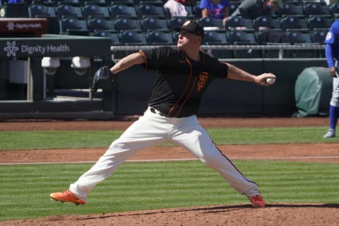 SF Giants relief pitcher Jake McGee (17) throws against the Chicago Cubs during a spring training game at Scottsdale Stadium. (Rick Scuteri-USA TODAY Sports)