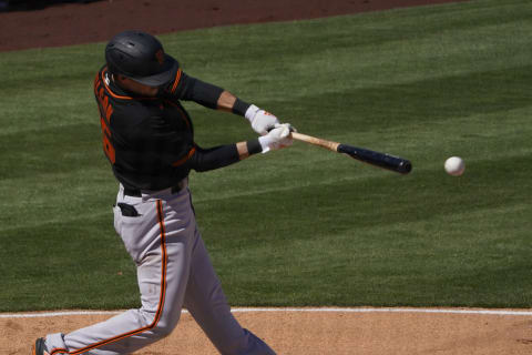 SF Giants infielder Will Wilson (85) hits a three-run double against the Los Angeles Angels during a spring training game at Tempe Diablo Stadium. (Rick Scuteri-USA TODAY Sports)