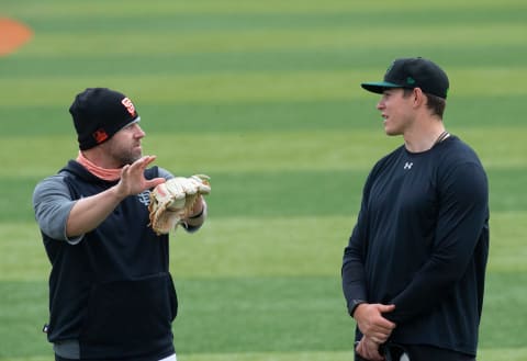 Eugene Emeralds Manager Dennis Pelfrey (left) talks to starting pitcher Seth Corry, one of several pitching prospects for the SF Giants who have arrived in Eugene for the Ems 2021 season.