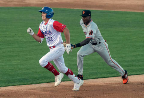 (5/11/21) Stockton Ports’ Tyler Soderstrom left, is chased by SF Giants prospect Marco Luciano after Soderstrom overran first while trying to stretch a single into a double during a California League baseball game at the Stockton Ballpark in downtown Stockton. Soderstrom was out on the play but advanced a runner to third. (CLIFFORD OTO/THE STOCKTON RECORD)