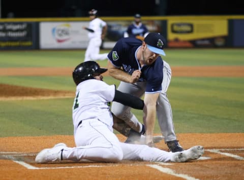 Hillsboro Hop’s pitcher Joe Jones, right, tries in vain for the tag at home on Eugene Emeralds’ (SF Giants Low-A affiliate) Diego Rincones in the 8th inning during the Em’s first home game of the 2021 season at PK Park in Eugene.