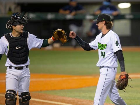 Eugene Emeralds catcher Patrick Bailey, left, congratulates pitcher Travis Perry at the end of the fifth inning against the Hillsboro Hops at PK Park in Eugene.