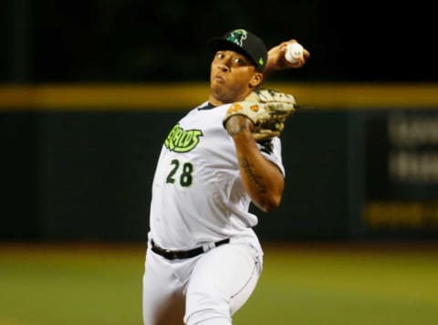 Eugene Emeralds pitcher Solomon Bates throws against the Hillsboro Hops in their first home game of the 2021 season at PK Park in Eugene.