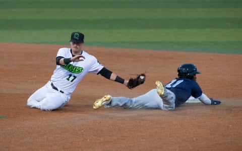 Eugene Emeralds Tyler Fitzgerald, can’t make the play as Hops’ DJ Burt slides under the tag stealing second.