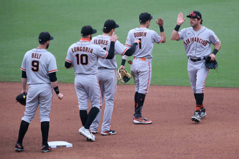 SF Giants players celebrate on the field after defeating the San Diego Padres at Petco Park. (Orlando Ramirez-USA TODAY Sports)