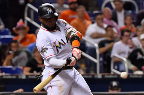 May 15, 2017; Miami, FL, USA; Miami Marlins left fielder Marcell Ozuna (13) singles in the fourth inning against the Houston Astros at Marlins Park. Mandatory Credit: Jasen Vinlove-USA TODAY Sports