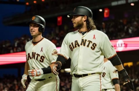 May 15, 2017; San Francisco, CA, USA; San Francisco Giants catcher Buster Posey (28) and shortstop Brandon Crawford (35) after scoring runs against the Los Angeles Dodgers during the fourth inning at AT&T Park. Mandatory Credit: Kelley L Cox-USA TODAY Sports