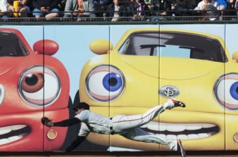 Jun 12, 2016; San Francisco, CA, USA; San Francisco Giants left fielder Mac Williamson (51) makes a diving catch for an out during the first inning against the Los Angeles Dodgers at AT&T Park. Mandatory Credit: Kenny Karst-USA TODAY Sports