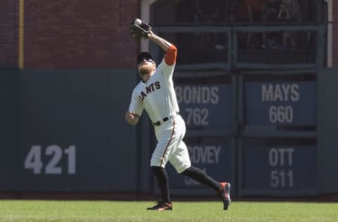 Oct 1, 2016; San Francisco, CA, USA; San Francisco Giants right fielder Hunter Pence (8) fields a fly ball hit by Los Angeles Dodgers third baseman Justin Turner (not pictured) during the first inning at AT&T Park. Mandatory Credit: Neville E. Guard-USA TODAY Sports