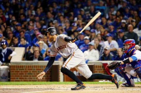 Oct 7, 2016; Chicago, IL, USA; San Francisco Giants right fielder Hunter Pence (8) hits a single against the Chicago Cubs during the second inning during game one of the 2016 NLDS playoff baseball series at Wrigley Field. Mandatory Credit: Jerry Lai-USA TODAY Sports