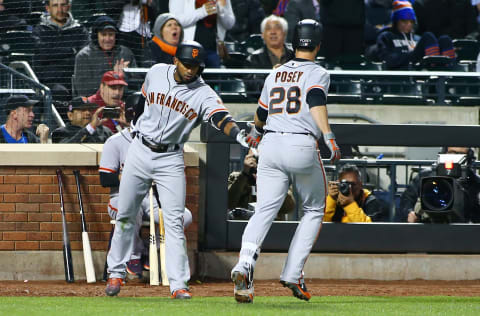 May 8, 2017; New York City, NY, USA; San Francisco Giants catcher Buster Posey (28) is congratulated by left fielder Eduardo Nunez (10) after hitting a solo home run against the New York Mets during the sixth inning at Citi Field. Mandatory Credit: Andy Marlin-USA TODAY Sports