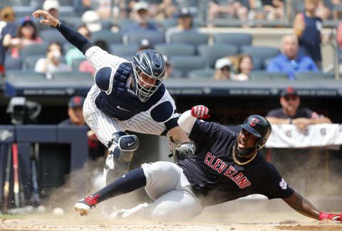 NEW YORK, NEW YORK – AUGUST 18: Franmil Reyes #32 of the Cleveland Indians beats the tag from Gary Sanchez #24 of the New York Yankees to score a run in the second inning at Yankee Stadium on August 18, 2019 in New York City. (Photo by Jim McIsaac/Getty Images)