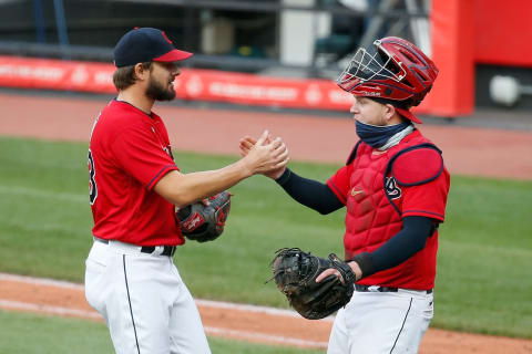 CLEVELAND, OH – SEPTEMBER 27: Brad Hand #33 of the Cleveland Indians is congratulated by Roberto Perez #55 after completing the save against the Pittsburgh Pirates at Progressive Field on September 27, 2020 in Cleveland, Ohio. Cleveland defeated Pittsburgh 8-6. (Photo by Kirk Irwin/Getty Images)