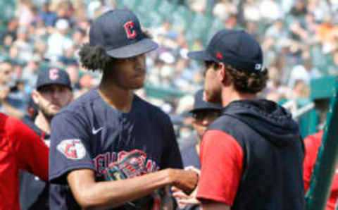 DETROIT, MI – MAY 29: Starting pitcher Triston McKenzie #24 of the Cleveland Guardians is greeted by pitcher Shane Bieber #57 after getting relieved during the eighth inning against the Detroit Tigers at Comerica Park on May 29, 2022, in Detroit, Michigan. (Photo by Duane Burleson/Getty Images)