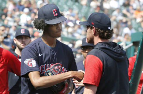 DETROIT, MI – MAY 29: Starting pitcher Triston McKenzie #24 of the Cleveland Guardians is greeted by pitcher Shane Bieber #57 after getting relieved during the eighth inning against the Detroit Tigers at Comerica Park on May 29, 2022, in Detroit, Michigan. (Photo by Duane Burleson/Getty Images)