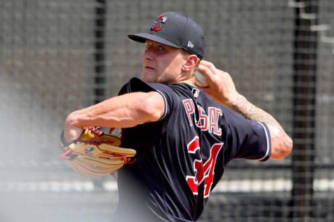 CLEVELAND, OHIO – JULY 08: Pitcher Zach Plesac #34 of the Cleveland Indians warms up in the bullpen during summer workouts at Progressive Field on July 08, 2020 in Cleveland, Ohio. (Photo by Jason Miller/Getty Images)