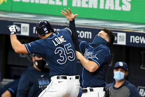 ST PETERSBURG, FLORIDA – SEPTEMBER 11: Nate Lowe #35 of the Tampa Bay Rays celebrates with Willy Adames #1 after hitting a solo homer during the sixth inning against the Boston Red Sox at Tropicana Field on September 11, 2020 in St Petersburg, Florida. (Photo by Douglas P. DeFelice/Getty Images)