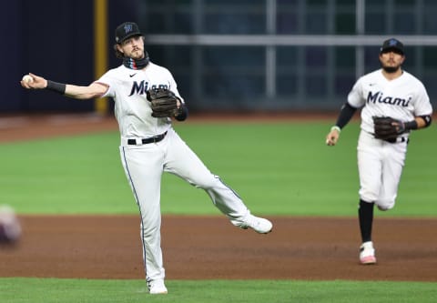 HOUSTON, TEXAS – OCTOBER 08: Brian Anderson #15 of the Miami Marlins fields a ball hit by Austin Riley #27 of the Atlanta Braves for an out during the fourth inning in Game Three of the National League Division Series at Minute Maid Park on October 08, 2020 in Houston, Texas. (Photo by Elsa/Getty Images)