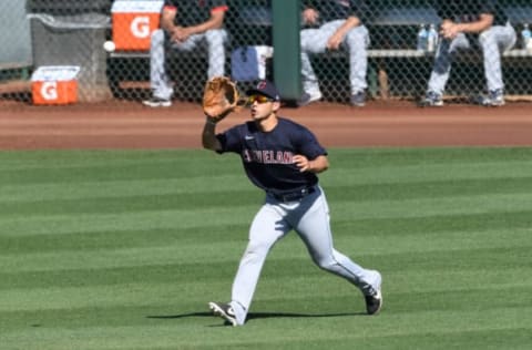 GLENDALE, ARIZONA – MARCH 20: Steven Kwan #1 of the Cleveland Indians catches a line drive hit by Eloy Jiménez #74 of the Chicago White Sox during the fifth inning of a spring training game at Camelback Ranch on March 20, 2021 in Glendale, Arizona. (Photo by Norm Hall/Getty Images)