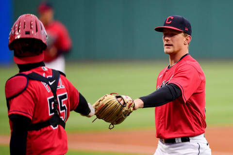 Roberto Perez #55 bumps gloves with Zach Plesac #34 of the Cleveland Indians (Photo by Emilee Chinn/Getty Images)