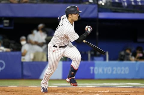 YOKOHAMA, JAPAN – AUGUST 07: Outfielder Seiya Suzuki #51 of Team Japan hits a single in the six during the gold medal game between Team United States and Team Japan on day fifteen of the Tokyo 2020 Olympic Games at Yokohama Baseball Stadium on August 07, 2021 in Yokohama, Kanagawa, Japan. (Photo by Steph Chambers/Getty Images)