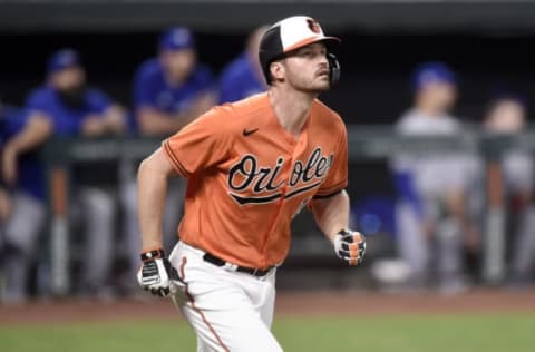 BALTIMORE, MARYLAND – SEPTEMBER 11: Trey Mancini #16 of the Baltimore Orioles runs to first base against the Toronto Blue Jays during game two of a doubleheader at Oriole Park at Camden Yards on September 11, 2021 in Baltimore, Maryland. (Photo by G Fiume/Getty Images)