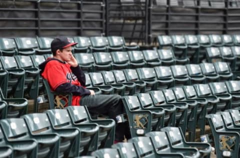 CLEVELAND, OHIO – SEPTEMBER 26: A Cleveland Indians fan takes in the view at Progressive Field after the game between the Cleveland Indians and the Chicago White Sox on September 26, 2021 in Cleveland, Ohio. The White Sox defeated the Indians 5-2. (Photo by Jason Miller/Getty Images)