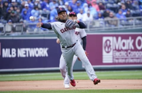 KANSAS CITY, MISSOURI – APRIL 07: Jose Ramirez #11 of the Cleveland Guardians throws to first to get the out on Whit Merrifield of the Kansas City Royals in the first inning on Opening Day at Kauffman Stadium on April 07, 2022 in Kansas City, Missouri. (Photo by Ed Zurga/Getty Images)