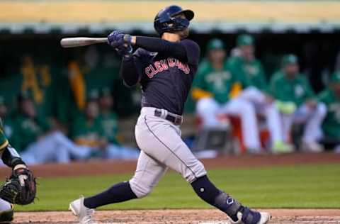 OAKLAND, CALIFORNIA – APRIL 29: Andres Gimenez #0 of the Cleveland Guardians hits a grand slam home run against the Oakland Athletics in the top of the third inning at RingCentral Coliseum on April 29, 2022 in Oakland, California. (Photo by Thearon W. Henderson/Getty Images)