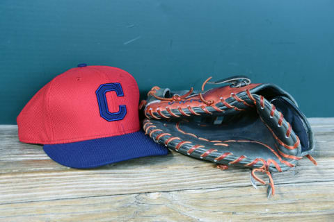 BALTIMORE, MD – JUNE 26: Cleveland Indians cap and glove in the dug out before a baseball game against the Baltimore Orioles at Oriole Park at Camden Yards on June 26, 2015 in Baltimore, Maryland. The Orioles won 4-0. (Photo by Mitchell Layton/Getty Images)